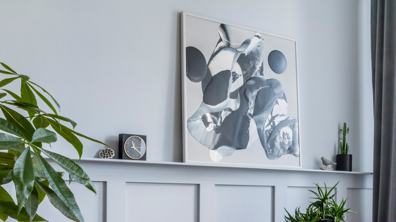 shelf with large art piece