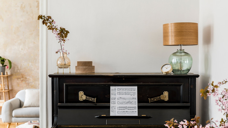 vintage alarm clock on piano